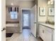 Bathroom with soaking tub, double vanity and private access at 1670 Moon Valley Dr, Davenport, FL 33896