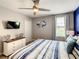 Bedroom with king-size bed, coastal decor, and window view at 1670 Moon Valley Dr, Davenport, FL 33896