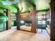 Jungle-themed bedroom with bunk beds, slide, and playful decor at 1670 Moon Valley Dr, Davenport, FL 33896