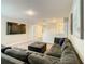 Large bonus room with sectional sofa and large TV at 1670 Moon Valley Dr, Davenport, FL 33896