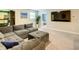 Spacious bonus room with sectional sofa, TV and access to bedroom at 1670 Moon Valley Dr, Davenport, FL 33896