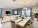 Elegant dining room with a large table and view into the living room at 1670 Moon Valley Dr, Davenport, FL 33896