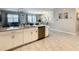 Modern kitchen with white cabinets, stainless steel appliances, and a large island at 1670 Moon Valley Dr, Davenport, FL 33896