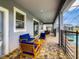 Relaxing covered patio with pool and outdoor seating at 1670 Moon Valley Dr, Davenport, FL 33896
