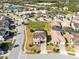 Aerial view of a beautiful community with houses and a lake at 181 Brookes Pl, Haines City, FL 33844