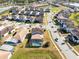 An aerial view showcasing a home with a pool in a residential community at 181 Brookes Pl, Haines City, FL 33844
