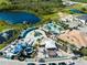 Resort-style pool with water park, expansive deck, and lush landscaping at 181 Brookes Pl, Haines City, FL 33844