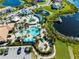 Community pool and water park with surrounding homes at 181 Brookes Pl, Haines City, FL 33844
