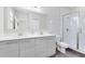 Modern bathroom with double vanity, large mirror, and shower at 181 Brookes Pl, Haines City, FL 33844