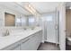 Modern bathroom with double sinks, a large mirror, and a shower at 181 Brookes Pl, Haines City, FL 33844