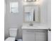 Clean bathroom with vanity, toilet, and mirror at 181 Brookes Pl, Haines City, FL 33844