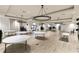 Large community room with elegant chandeliers and ample seating at 181 Brookes Pl, Haines City, FL 33844