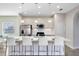 Modern kitchen with white cabinets, stainless steel appliances and breakfast bar at 181 Brookes Pl, Haines City, FL 33844