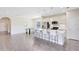 Modern kitchen with white cabinets, stainless steel appliances and breakfast bar at 181 Brookes Pl, Haines City, FL 33844