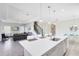 Modern kitchen with white cabinets, center island, and breakfast bar at 181 Brookes Pl, Haines City, FL 33844
