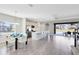 Open concept kitchen with island, stainless steel appliances, and dining area at 181 Brookes Pl, Haines City, FL 33844