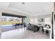 Spacious living room with sliding doors opening to pool area at 181 Brookes Pl, Haines City, FL 33844