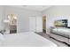 Spacious bedroom with TV, dresser and ensuite bathroom at 181 Brookes Pl, Haines City, FL 33844