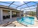 Sparkling screened pool with patio and lounge chairs at 181 Brookes Pl, Haines City, FL 33844