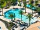 Relaxing pool with palm trees and plenty of lounge chairs at 181 Brookes Pl, Haines City, FL 33844