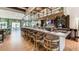Upscale bar with comfortable seating and a large TV screen at 1840 Caribbean View Ter, Kissimmee, FL 34747