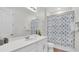 Clean bathroom with a vanity, toilet, and shower/tub combo at 1840 Caribbean View Ter, Kissimmee, FL 34747