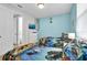 ' bedroom with twin beds and fun, ocean-themed bedding at 1840 Caribbean View Ter, Kissimmee, FL 34747