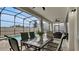 Covered patio with seating area, dining table, and view of the pool at 1840 Caribbean View Ter, Kissimmee, FL 34747