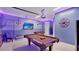 Game room features a pool table, foosball table, and TV at 1840 Caribbean View Ter, Kissimmee, FL 34747