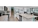 Modern kitchen with white cabinets, stainless steel appliances, and an island at 1840 Caribbean View Ter, Kissimmee, FL 34747