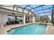 Inviting pool and spa area with covered patio and seating at 1840 Caribbean View Ter, Kissimmee, FL 34747