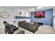 Home theater with comfortable seating and large screen TV at 1840 Caribbean View Ter, Kissimmee, FL 34747
