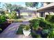 Landscaped backyard oasis with brick pavers and lush greenery at 772 Bear Creek Cir, Winter Springs, FL 32708
