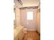 Bathroom with striped wallpaper and updated toilet at 772 Bear Creek Cir, Winter Springs, FL 32708