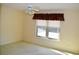 Bright bedroom with large window and carpet at 772 Bear Creek Cir, Winter Springs, FL 32708