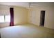 Well-lit bedroom featuring a large window and carpet at 772 Bear Creek Cir, Winter Springs, FL 32708