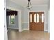 Grand entryway with wood door and hardwood floors at 772 Bear Creek Cir, Winter Springs, FL 32708
