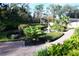 Formal gardens with manicured hedges, fountain, and brick paths at 772 Bear Creek Cir, Winter Springs, FL 32708