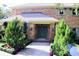 Elegant entryway with a green door and manicured landscaping at 772 Bear Creek Cir, Winter Springs, FL 32708