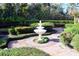Serene garden with fountain and brick walkways at 772 Bear Creek Cir, Winter Springs, FL 32708