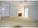 Bright living room with fireplace and built-in shelving offers lots of natural light at 772 Bear Creek Cir, Winter Springs, FL 32708