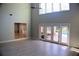 Spacious living room with high ceilings, hardwood floors, and access to the pool at 772 Bear Creek Cir, Winter Springs, FL 32708