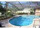 Inviting screened pool area with a freeform pool and ample deck space at 772 Bear Creek Cir, Winter Springs, FL 32708