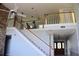 Elegant staircase leading to upper level with a loft area at 772 Bear Creek Cir, Winter Springs, FL 32708