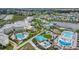 Aerial view of resort with pools, landscaping, and hotel at 8135 Coconut Pl, Kissimmee, FL 34747