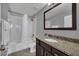 Bathroom with tub, shower, and granite countertop at 8169 Roseville Rd, Davenport, FL 33896
