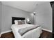 Well lit bedroom with a double bed and wood floors at 8169 Roseville Rd, Davenport, FL 33896