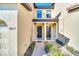 Two-story townhome with double front doors and paver walkway at 8169 Roseville Rd, Davenport, FL 33896