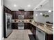 Modern kitchen with stainless steel appliances and granite counters at 8169 Roseville Rd, Davenport, FL 33896