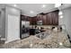 Modern kitchen with island, stainless steel appliances, and granite counters at 8169 Roseville Rd, Davenport, FL 33896